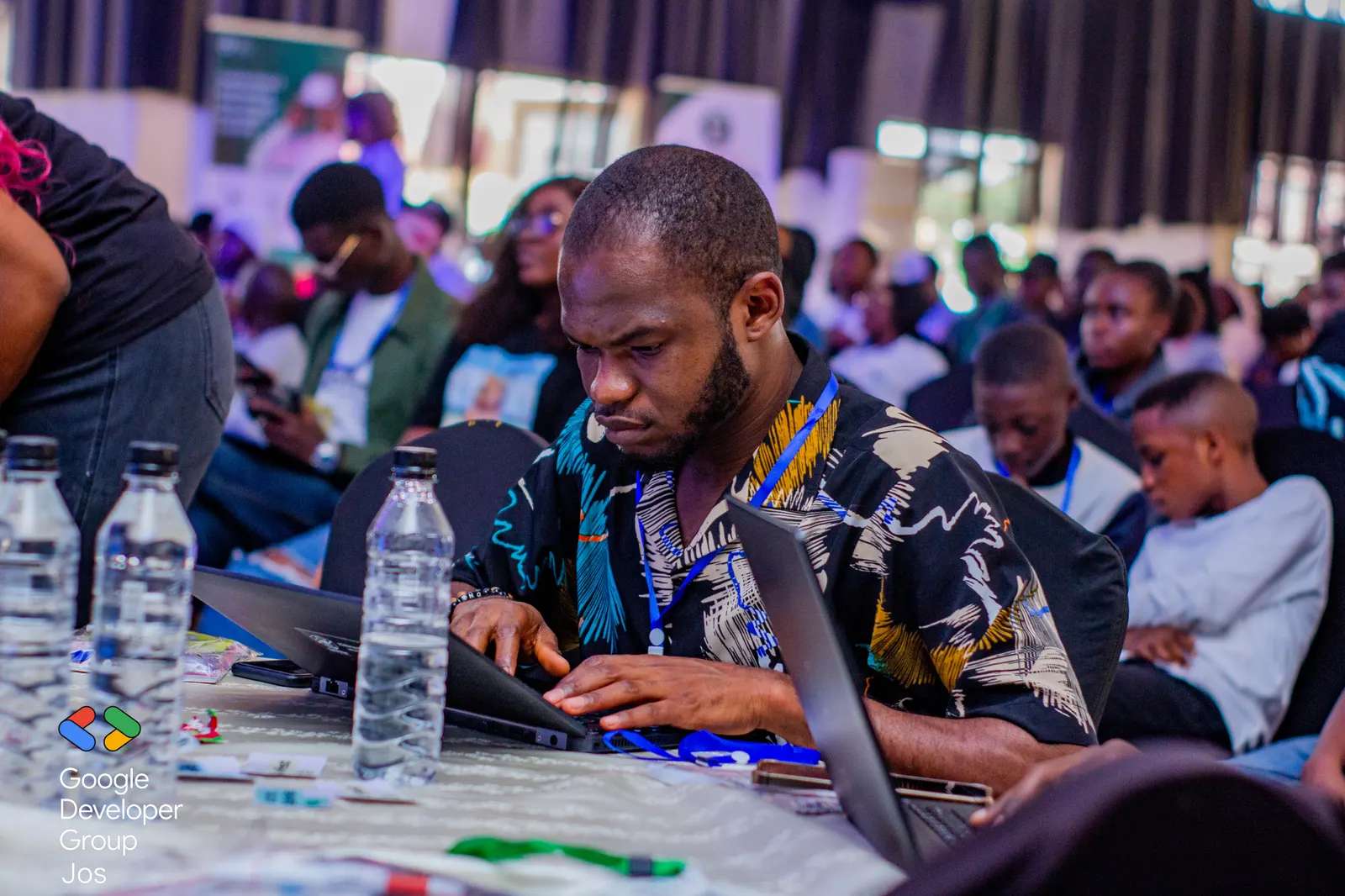 An attendee coding on his laptop during a workshop