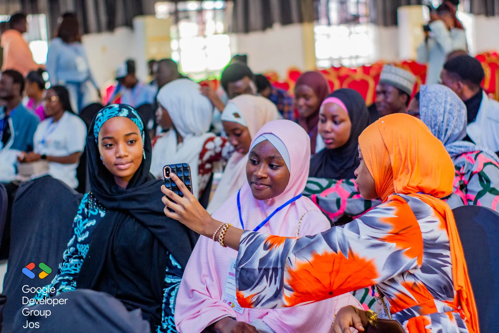 Attendees taking a selfie at DevFest Jos 2025